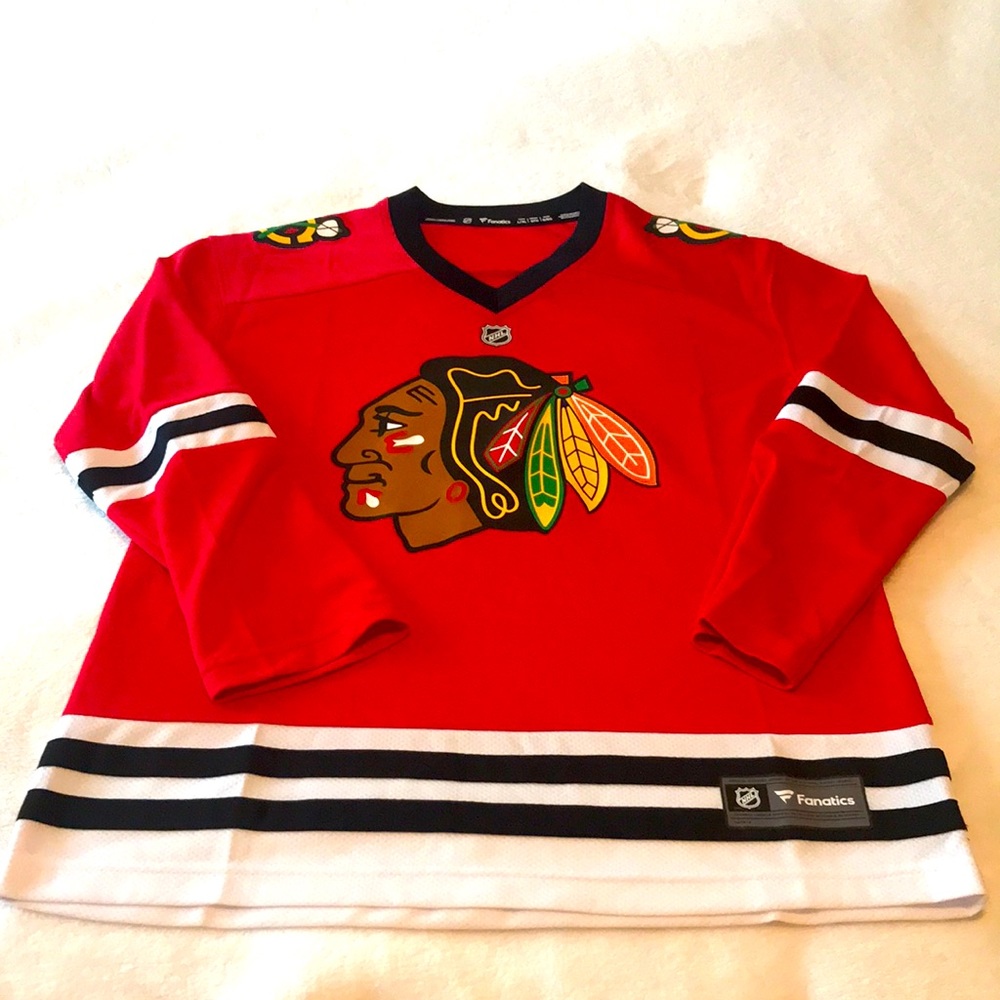 Brand new never worn Chicago Blackhawks Hockey jersey. Youth boys size XL & Red.